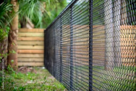 Residential Chain Link Fence Systems
✔ Affordable and durable protection for your home, pets, and children
✔ Customizable options to enhance curb appeal and security
✔ Available in galvanized and vinyl-coated finishes for longevity
Commercial & Industrial Chain Link Fence Systems
✔ Cost-effective security for businesses, warehouses, and job sites
✔ Custom heights and gauges for added strength and durability
✔ Options for barbed wire, privacy slats, and security enhancements
Tennis Court Chain Link Fence Systems
✔ Sturdy and weather-resistant fencing for tennis courts and sports facilities
✔ Provides clear sightlines while ensuring safety and durability
✔ Available in standard and custom heights to meet regulations Durable, Affordable, and Built to Last At Exterior Fence Builders, Inc., we specialize in high-quality chain-link fencing—one of the most economical and durable fencing options available today. Whether for residential, commercial, or recreational use, our chain-link fence systems provide security, strength, and versatility while seamlessly blending with your landscaping. We offer a wide selection of gauges (weights) and coatings, including galvanized and vinyl-coated finishes, ensuring long-lasting protection against the elements.